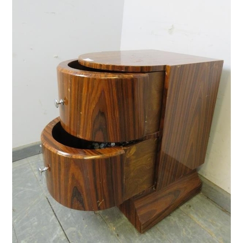 745 - An Art Deco Period lacquered rosewood bow-fronted side cabinet, housing two drawers with chromed kno... 