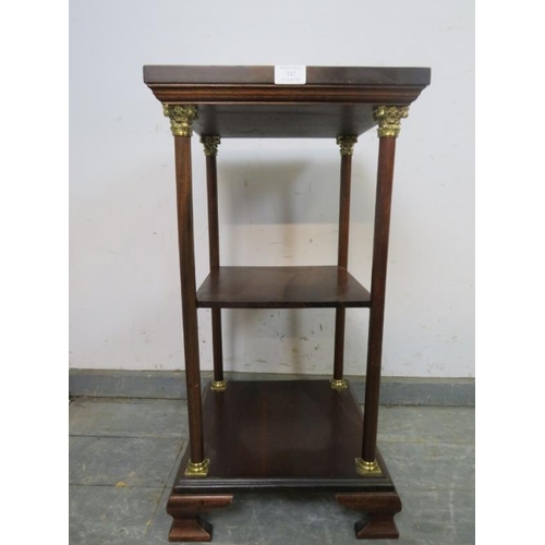 747 - A reproduction mahogany three-tier whatnot, the plain columns with gilt brass Corinthian Style capit... 