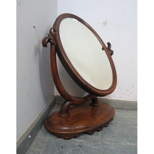 750 - A large 19th century oval mahogany swing vanity mirror, the acanthus carved uprights on a plinth bas... 