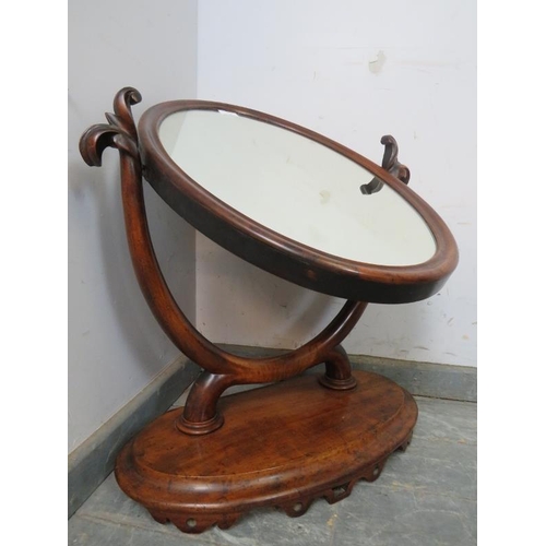 750 - A large 19th century oval mahogany swing vanity mirror, the acanthus carved uprights on a plinth bas... 