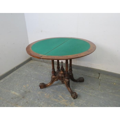 755 - A Victorian burr walnut demi-lune turnover card table, the top with marquetry inlay, on a cluster co... 