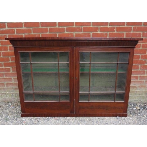 756 - A 19th century mahogany gun cabinet, the glazed door s opening onto loose shelves, above 10 short oa... 