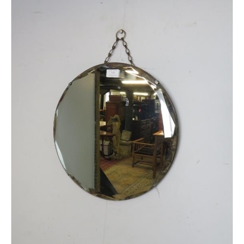 759 - An Art Deco Period circular wall mirror, with bevelled edge. 
Diameter 40cm (approx).
Condition repo... 