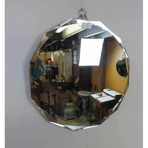 760 - An Art Deco Period dodecahedral wall mirror with bevelled edge.
Diameter 46cm (approx).
Condition re... 