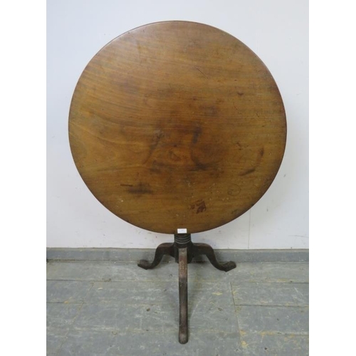 801 - A 19th century Cuban mahogany circular tilt-top table, on a turned pedestal with splayed tripod supp... 