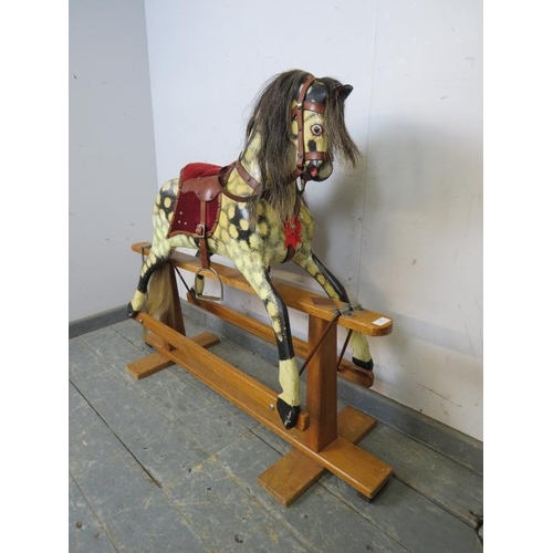 809 - A vintage rocking horse hand-painted dapple grey, with real horsehair mane and tail and leather tack... 