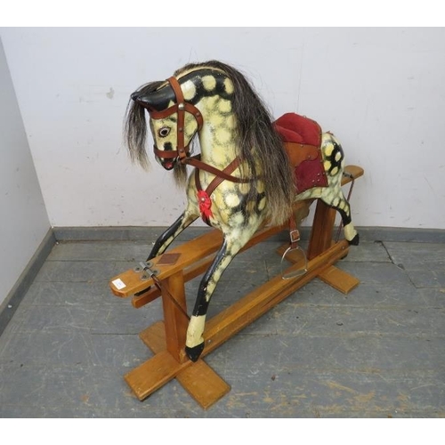 809 - A vintage rocking horse hand-painted dapple grey, with real horsehair mane and tail and leather tack... 