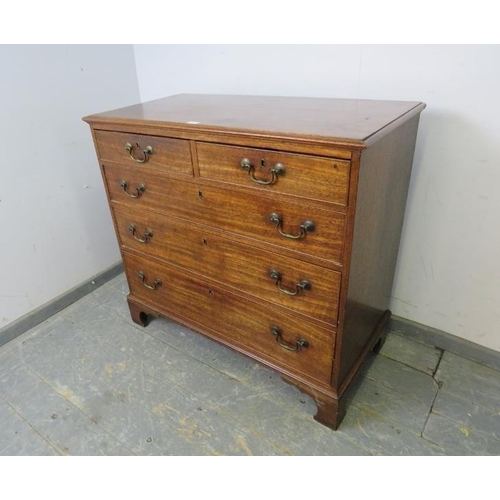 814 - A Georgian mahogany chest, housing two short and three long graduated, cock-beaded drawers with oak ... 