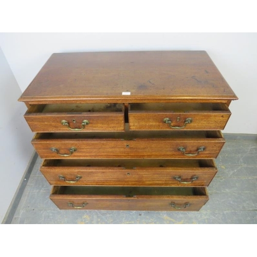 814 - A Georgian mahogany chest, housing two short and three long graduated, cock-beaded drawers with oak ... 