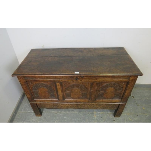 818 - A 17th century oak mule chest, with internal candle box, the front panels with arcaded decoration ab... 