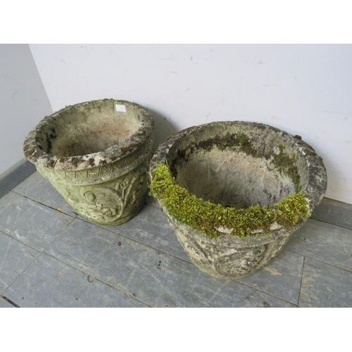 838 - A pair of weathered reconstituted stone garden planters, with relief moulded scrolled decoration.
H3... 