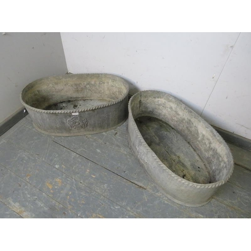 841 - A pair of vintage lead trough planters, with rope twist decoration to rims and relief cast Tudor ros... 