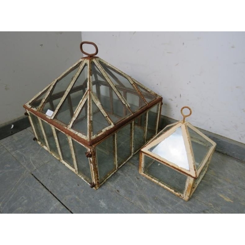 842 - A Victorian cast iron garden cloche with removeable lid and glazed panels. Together with a smaller g... 