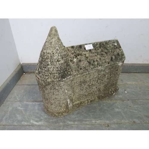 844 - A weathered reconstituted stone garden ornament modelled as a traditional oast house. 
H40cm W46cm D... 