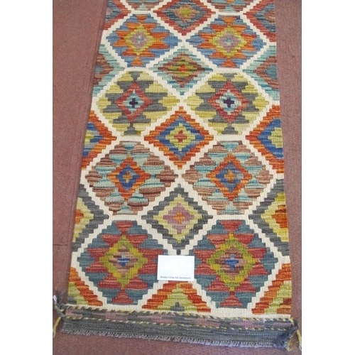 855 - A fine Chobi Kilim rug, central interlocking diamond pattern with strong colours and good condition.... 