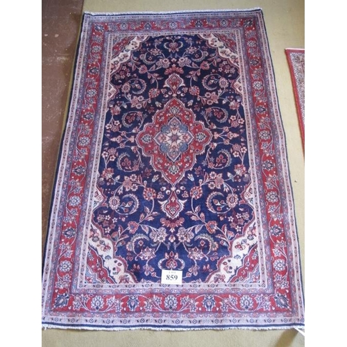 859 - North West Persian Sarouk rug.  Similar to Kashan with central medallion, red on blue and foliage su... 