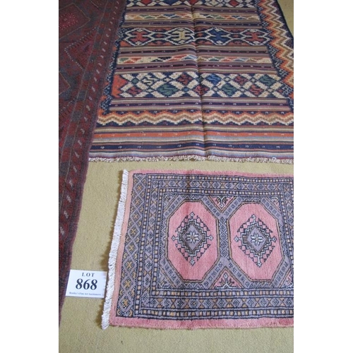 868 - A Meshwani runner, repeat central pattern on a burgundy ground. Good condition. 246cm x 58cm (approx... 