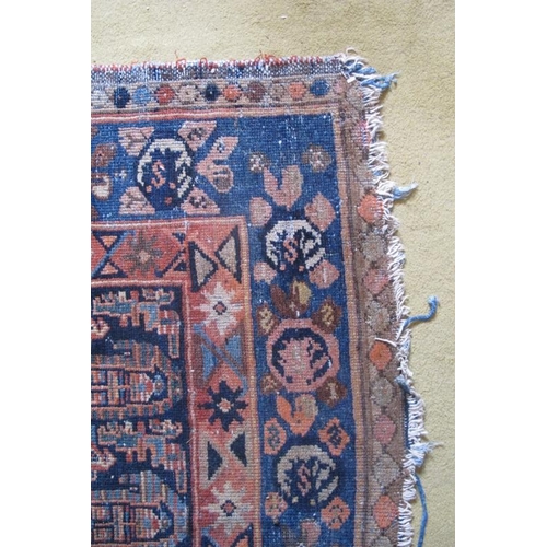 869 - An antique early 20th century Malayer rug with overall Boteh motifs and a three tier border. Rust/te... 