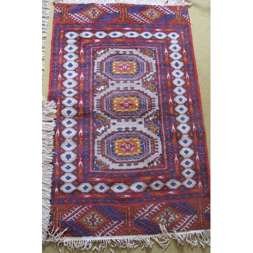 874 - Three rugs, to include a Persian and wool rugs. Largest rug 130cm x 80cm (approx).
Condition report:... 