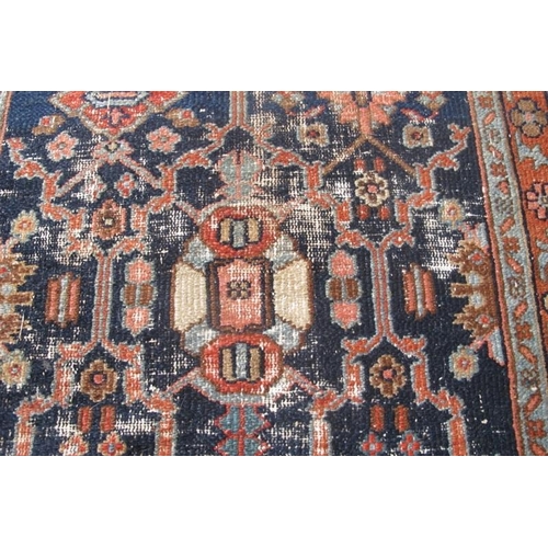 875 - A late 19th/20th century Persian rug on blue ground. 134cm x 78cm (approx).
Condition report: Some o... 