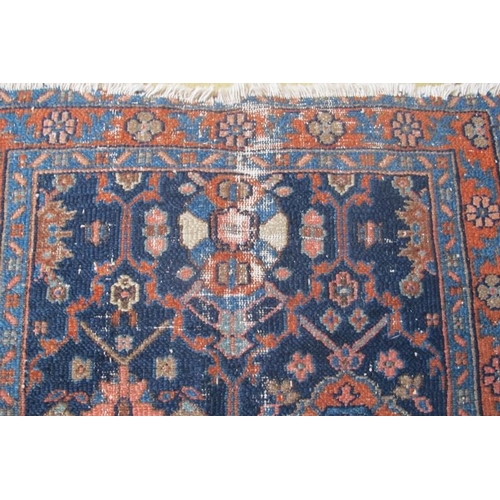 875 - A late 19th/20th century Persian rug on blue ground. 134cm x 78cm (approx).
Condition report: Some o... 