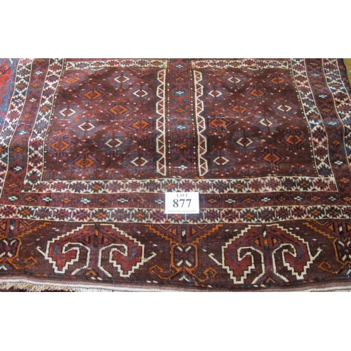 877 - A fine Yomud Turkoman early 20th century rug with four sectioned repeat central pattern on deep red ... 