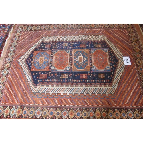 878 - A Persian Afshar rug with central panel containing four large motifs on blue ground, flanked by a bl... 