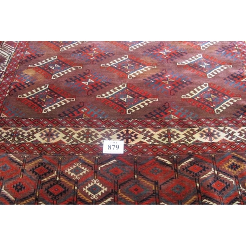 879 - A large Turkoman Yomut 20th century carpet with a repeat central pattern and deep borders. 360cm x 2... 