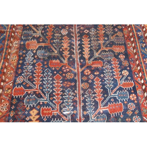 880 - A fine early 20th century Persian Gabbeh carpet, 'Tree of Life' pattern. 356cm x 154cm (approx).
Con... 