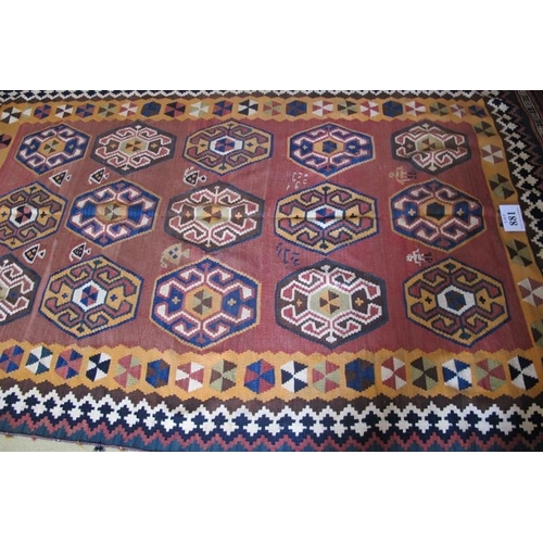 881 - A large Qashqai Kilim rug with fifteen central motifs & stylised figures. 270cm x 150cm (approx).
Co... 