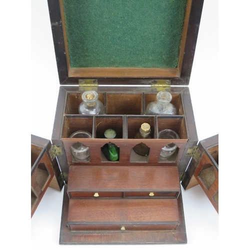 12 - An antique mahogany travellers apothecary medicine box, 19th century. With compartmented interior an... 