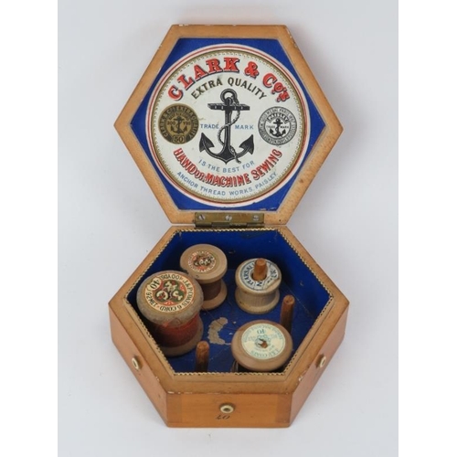 122 - Three Mauchline ware sewing boxes and a cotton reel bobbin holder, 19th century. The boxes with pict... 