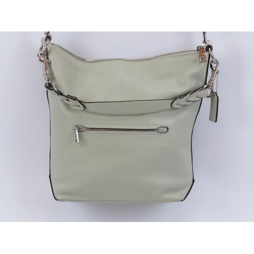 125 - A Coach ‘Abby’ leather duffle bag. Mint green leather with silver hardware, adjustable / removable c... 