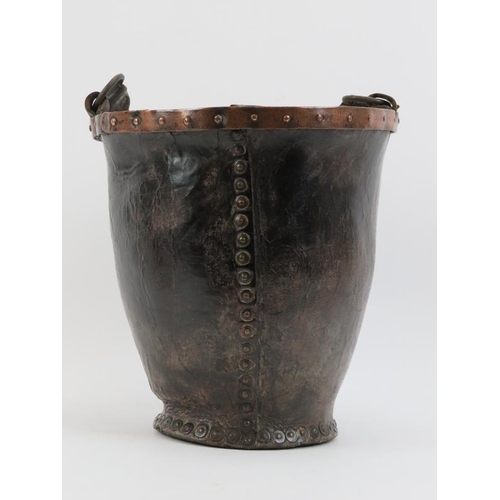 133 - A Georgian copper banded and studded leather fire bucket with strap handle, 18th century.
Condition ... 