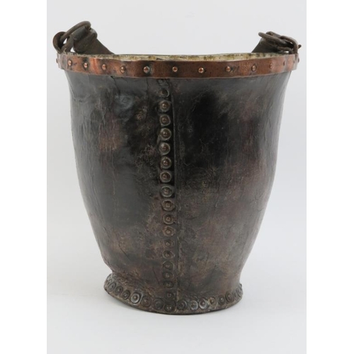 133 - A Georgian copper banded and studded leather fire bucket with strap handle, 18th century.
Condition ... 