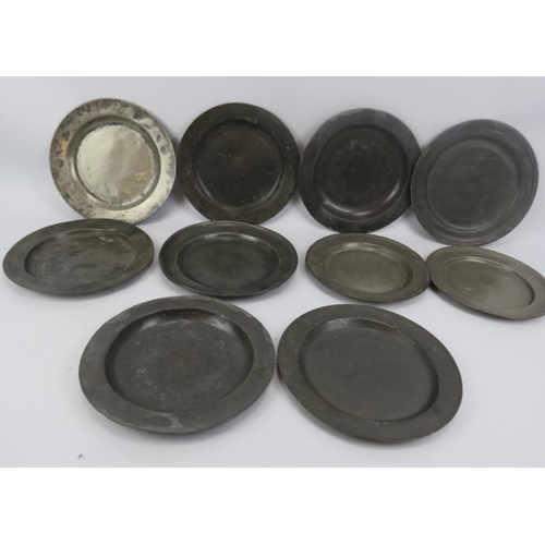 145 - A quantity of antique pewter including 10 plates, four measures and an engraved tobacco jar.  Plates... 