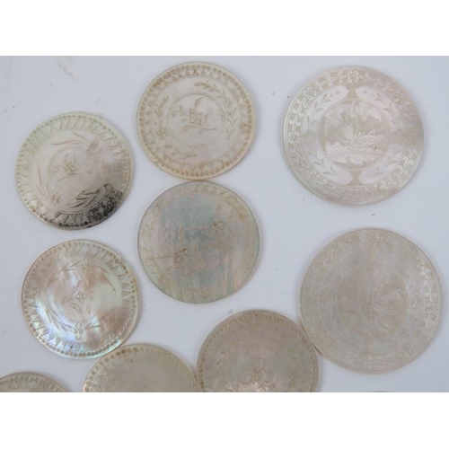 164 - A collection of Chinese mother of pearl finely engraved gaming tokens. (Quantity) 4.3 cm diameter of... 