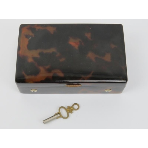 166 - A rare Swiss miniature tortoiseshell musical snuff box, 19th century. With a horn dust cover display... 