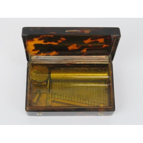 166 - A rare Swiss miniature tortoiseshell musical snuff box, 19th century. With a horn dust cover display... 