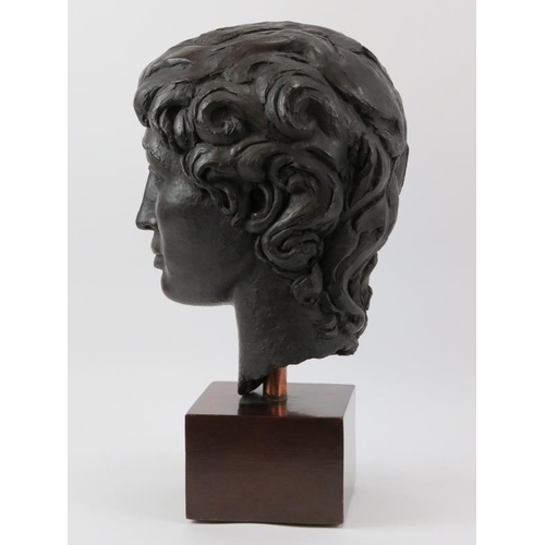 167 - A large bronzed study of a female head, late 20th century. ‘PJW’ monogram to the reverse. Displayed ... 