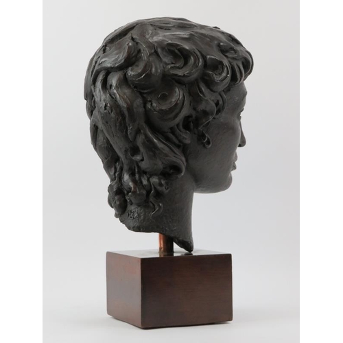 167 - A large bronzed study of a female head, late 20th century. ‘PJW’ monogram to the reverse. Displayed ... 