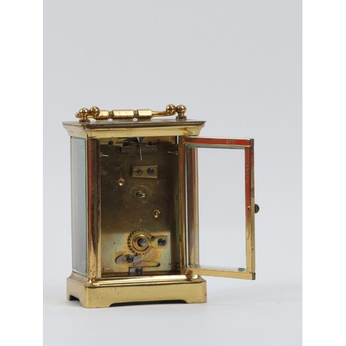 169 - A gilt brass carriage clock, late 19th/early 20th century. Housed within a brown leather box. Key in... 