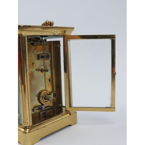 169 - A gilt brass carriage clock, late 19th/early 20th century. Housed within a brown leather box. Key in... 