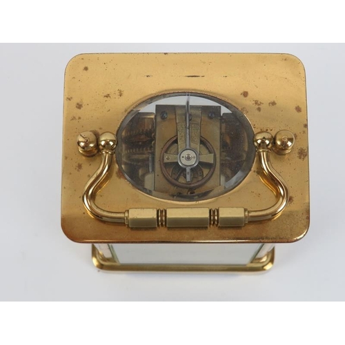 169 - A gilt brass carriage clock, late 19th/early 20th century. Housed within a brown leather box. Key in... 