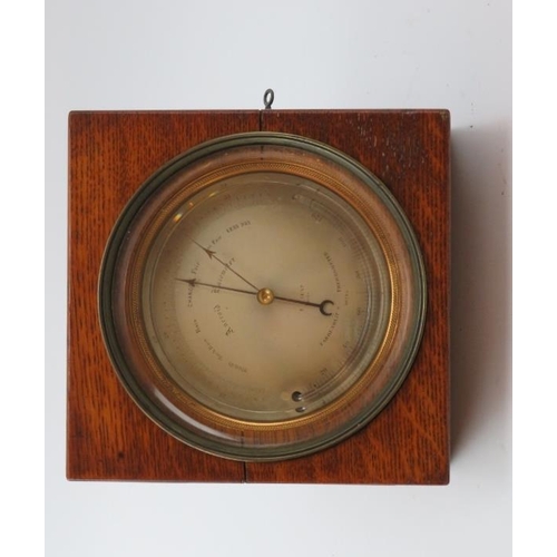 172 - A French oak cased gilt metal desk top combined aneroid barometer and thermometer by E J Dent of Par... 