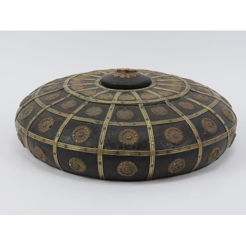 184 - A North Indian brass mounted turned wood tobacco jar, 20th century. 24.5 cm diameter. 
Condition rep... 