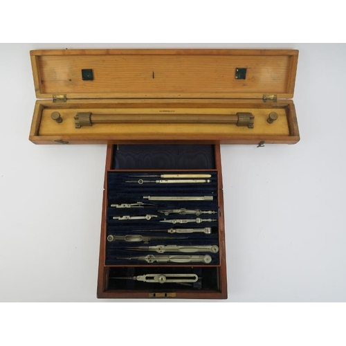 19 - Militaria: A vintage British Naval drawing set and parallel rolling rule. Both boxed, the drawing se... 