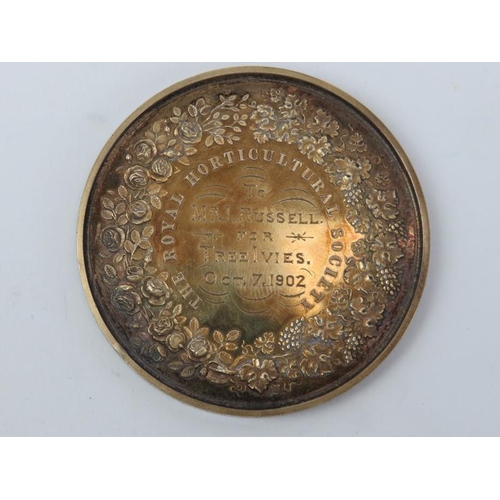 205 - A gilt metal Royal Horticultural Society medal and two bronze photographic related medals. 5.5 cm la... 