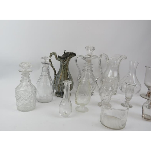 216 - A group of glassware and ceramic items, 19th/early 20th century. Decanters, jugs, a toddy lifter, a ... 