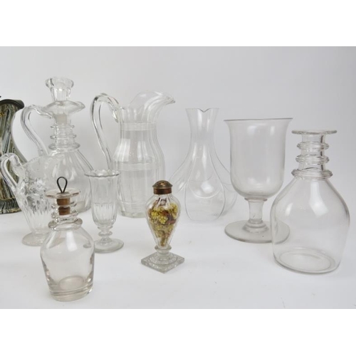 216 - A group of glassware and ceramic items, 19th/early 20th century. Decanters, jugs, a toddy lifter, a ... 